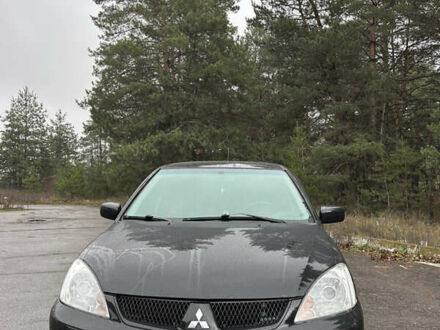 Черный Мицубиси Лансер, объемом двигателя 1.58 л и пробегом 254 тыс. км за 5000 $, фото 1 на Automoto.ua