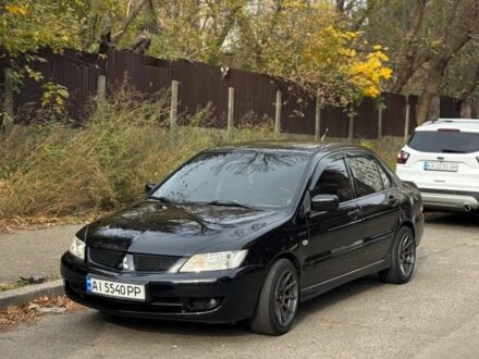 Черный Мицубиси Лансер, объемом двигателя 1.6 л и пробегом 211 тыс. км за 5600 $, фото 1 на Automoto.ua