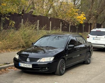 Черный Мицубиси Лансер, объемом двигателя 1.6 л и пробегом 211 тыс. км за 5600 $, фото 1 на Automoto.ua