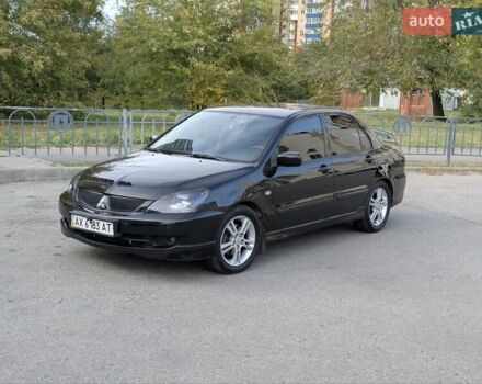 Чорний Міцубісі Lancer, об'ємом двигуна 2 л та пробігом 152 тис. км за 5500 $, фото 1 на Automoto.ua
