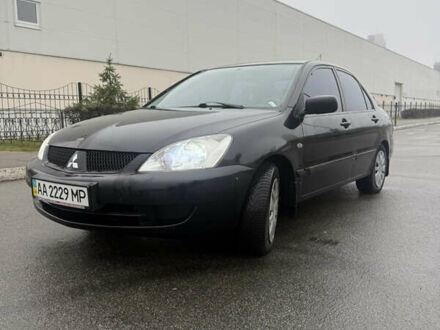 Черный Мицубиси Лансер, объемом двигателя 1.58 л и пробегом 256 тыс. км за 3700 $, фото 1 на Automoto.ua