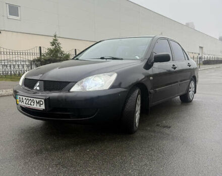 Чорний Міцубісі Lancer, об'ємом двигуна 1.58 л та пробігом 256 тис. км за 3700 $, фото 1 на Automoto.ua