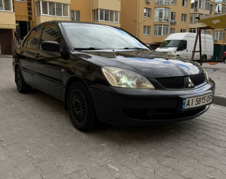 Чорний Міцубісі Lancer, об'ємом двигуна 1.58 л та пробігом 329 тис. км за 3700 $, фото 1 на Automoto.ua