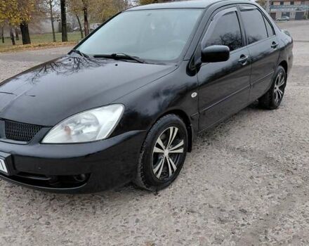 Черный Мицубиси Лансер, объемом двигателя 1.58 л и пробегом 201 тыс. км за 4500 $, фото 1 на Automoto.ua