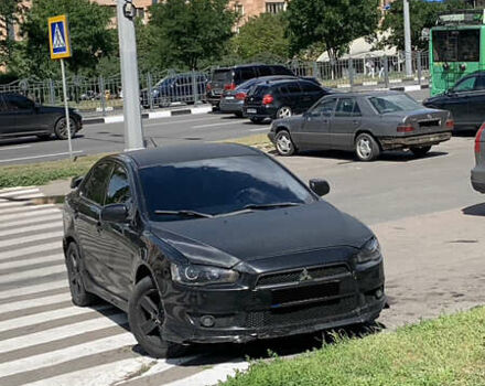 Чорний Міцубісі Lancer, об'ємом двигуна 2 л та пробігом 170 тис. км за 5775 $, фото 1 на Automoto.ua