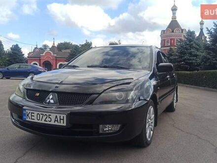 Черный Мицубиси Лансер, объемом двигателя 1.6 л и пробегом 345 тыс. км за 4800 $, фото 1 на Automoto.ua
