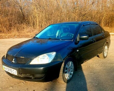 Черный Мицубиси Лансер, объемом двигателя 1.6 л и пробегом 300 тыс. км за 3600 $, фото 1 на Automoto.ua
