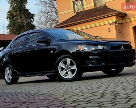Чорний Міцубісі Lancer, об'ємом двигуна 2 л та пробігом 260 тис. км за 6555 $, фото 1 на Automoto.ua