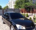 Чорний Міцубісі Lancer, об'ємом двигуна 1.6 л та пробігом 230 тис. км за 6500 $, фото 1 на Automoto.ua