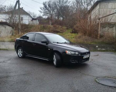 Черный Мицубиси Лансер, объемом двигателя 2 л и пробегом 116 тыс. км за 7200 $, фото 1 на Automoto.ua