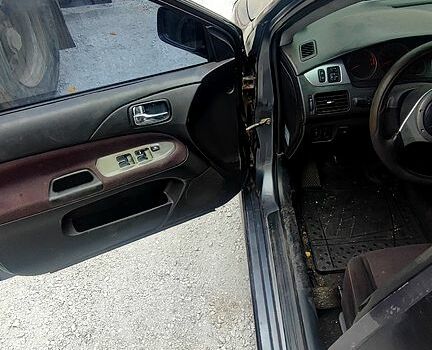 Чорний Міцубісі Lancer, об'ємом двигуна 2 л та пробігом 200 тис. км за 1800 $, фото 1 на Automoto.ua