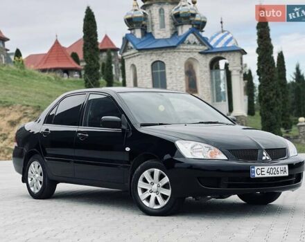 Чорний Міцубісі Lancer, об'ємом двигуна 1.6 л та пробігом 243 тис. км за 4950 $, фото 1 на Automoto.ua