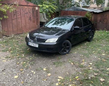 Чорний Міцубісі Lancer, об'ємом двигуна 1.6 л та пробігом 258 тис. км за 3099 $, фото 1 на Automoto.ua