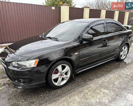 Черный Мицубиси Лансер, объемом двигателя 2 л и пробегом 188 тыс. км за 6300 $, фото 1 на Automoto.ua