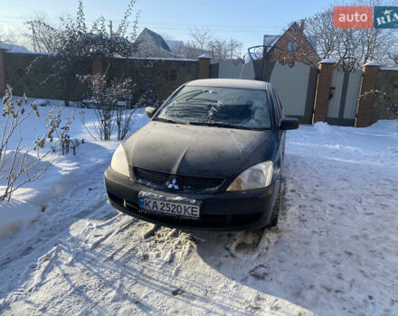 Черный Мицубиси Лансер, объемом двигателя 1.58 л и пробегом 300 тыс. км за 2700 $, фото 1 на Automoto.ua