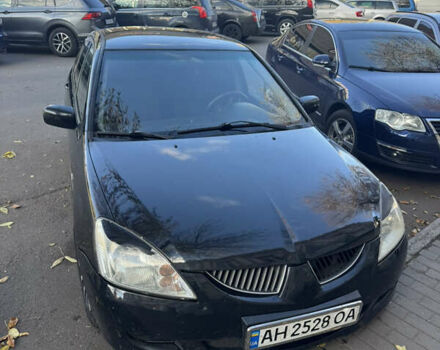 Чорний Міцубісі Lancer, об'ємом двигуна 1.58 л та пробігом 243 тис. км за 3800 $, фото 1 на Automoto.ua