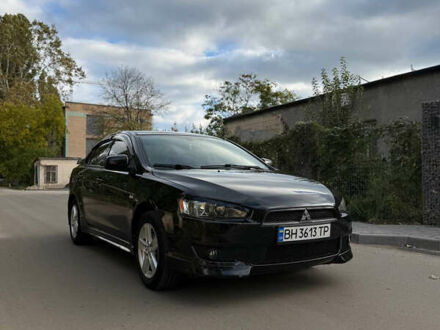 Черный Мицубиси Лансер, объемом двигателя 2 л и пробегом 219 тыс. км за 6400 $, фото 1 на Automoto.ua