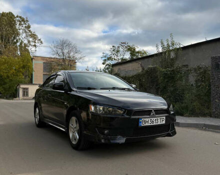 Черный Мицубиси Лансер, объемом двигателя 2 л и пробегом 219 тыс. км за 6400 $, фото 1 на Automoto.ua