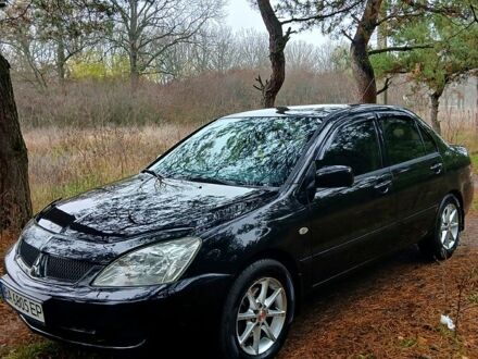 Черный Мицубиси Лансер, объемом двигателя 1.6 л и пробегом 240 тыс. км за 4700 $, фото 1 на Automoto.ua