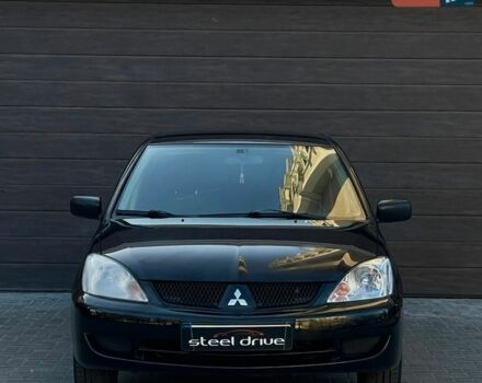 Черный Мицубиси Лансер, объемом двигателя 1.6 л и пробегом 291 тыс. км за 3799 $, фото 1 на Automoto.ua