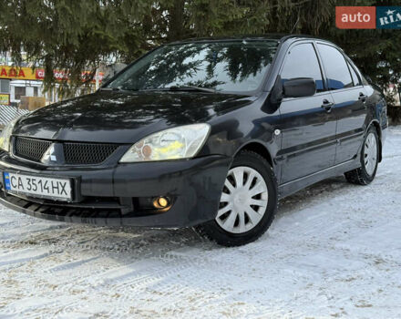Чорний Міцубісі Lancer, об'ємом двигуна 1.6 л та пробігом 190 тис. км за 3450 $, фото 1 на Automoto.ua