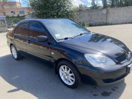 Черный Мицубиси Лансер, объемом двигателя 1.6 л и пробегом 215 тыс. км за 3900 $, фото 1 на Automoto.ua