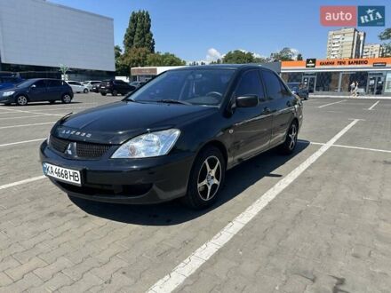 Чорний Міцубісі Lancer, об'ємом двигуна 1.58 л та пробігом 260 тис. км за 3600 $, фото 1 на Automoto.ua