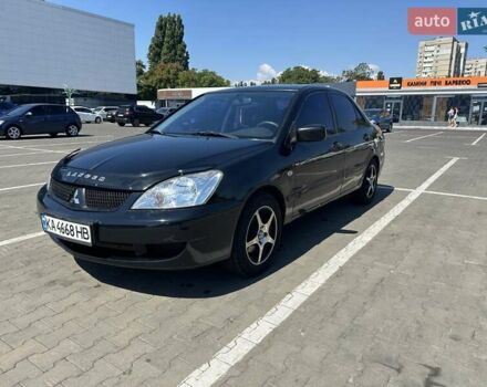 Чорний Міцубісі Lancer, об'ємом двигуна 1.58 л та пробігом 260 тис. км за 3600 $, фото 1 на Automoto.ua