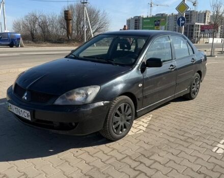 Черный Мицубиси Лансер, объемом двигателя 1.6 л и пробегом 280 тыс. км за 3200 $, фото 1 на Automoto.ua