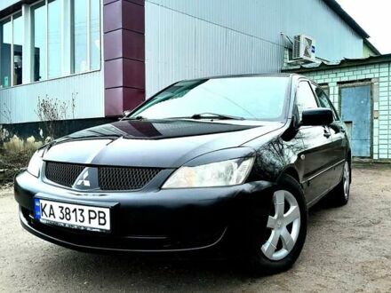 Черный Мицубиси Лансер, объемом двигателя 1.6 л и пробегом 280 тыс. км за 4750 $, фото 1 на Automoto.ua