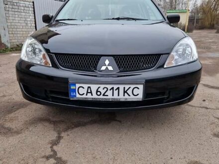 Чорний Міцубісі Lancer, об'ємом двигуна 1.6 л та пробігом 273 тис. км за 3999 $, фото 1 на Automoto.ua