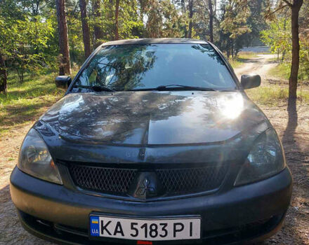 Чорний Міцубісі Lancer, об'ємом двигуна 2 л та пробігом 290 тис. км за 3300 $, фото 1 на Automoto.ua