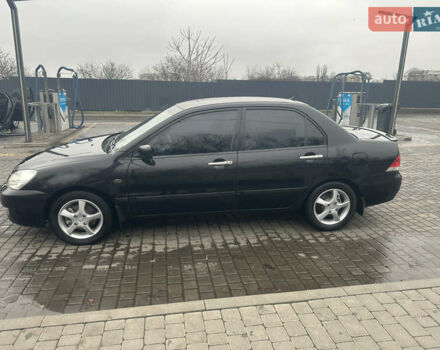 Чорний Міцубісі Lancer, об'ємом двигуна 1.6 л та пробігом 270 тис. км за 4500 $, фото 1 на Automoto.ua