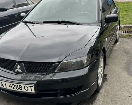 Черный Мицубиси Лансер, объемом двигателя 2 л и пробегом 219 тыс. км за 4400 $, фото 1 на Automoto.ua