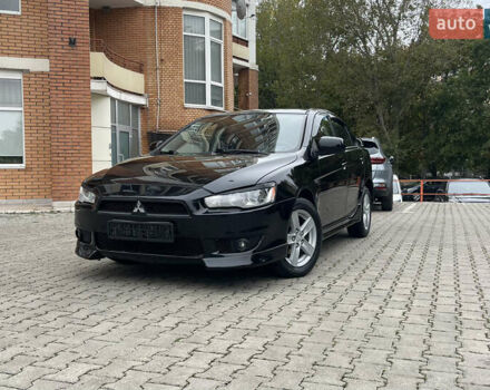 Черный Мицубиси Лансер, объемом двигателя 2 л и пробегом 200 тыс. км за 6199 $, фото 1 на Automoto.ua