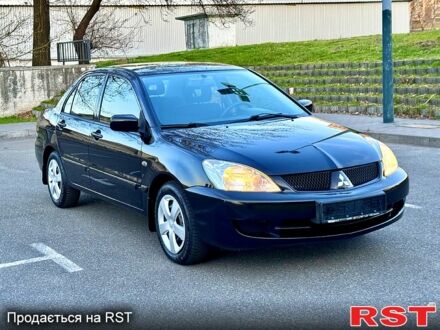 Міцубісі Lancer 2007 у Києві на Automoto.ua Чорний Міцубісі Lancer, об'ємом двигуна 16 л та пробігом 264 тис. км за 3850 $, фото 1 на Automoto.ua