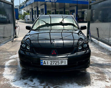 Чорний Міцубісі Lancer, об'ємом двигуна 2 л та пробігом 380 тис. км за 5000 $, фото 1 на Automoto.ua