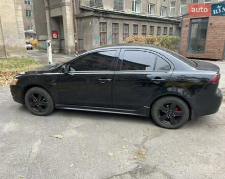 Чорний Міцубісі Lancer, об'ємом двигуна 2 л та пробігом 228 тис. км за 6200 $, фото 1 на Automoto.ua