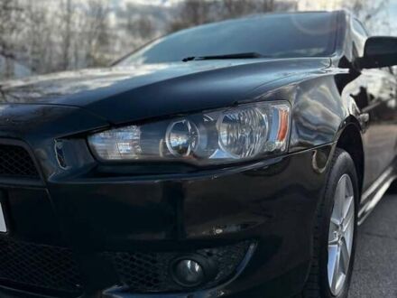 Черный Мицубиси Лансер, объемом двигателя 2 л и пробегом 224 тыс. км за 7000 $, фото 1 на Automoto.ua