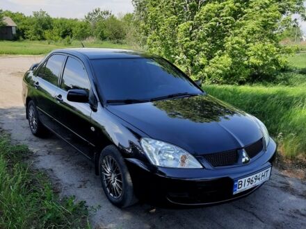 Чорний Міцубісі Lancer, об'ємом двигуна 1.6 л та пробігом 220 тис. км за 5500 $, фото 1 на Automoto.ua