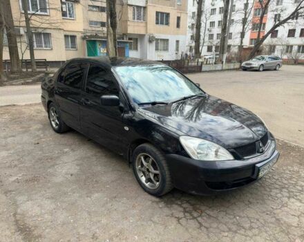 Черный Мицубиси Лансер, объемом двигателя 1.6 л и пробегом 151 тыс. км за 4500 $, фото 1 на Automoto.ua