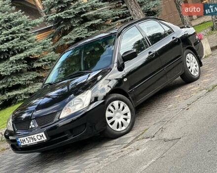 Чорний Міцубісі Lancer, об'ємом двигуна 1.58 л та пробігом 283 тис. км за 4400 $, фото 1 на Automoto.ua