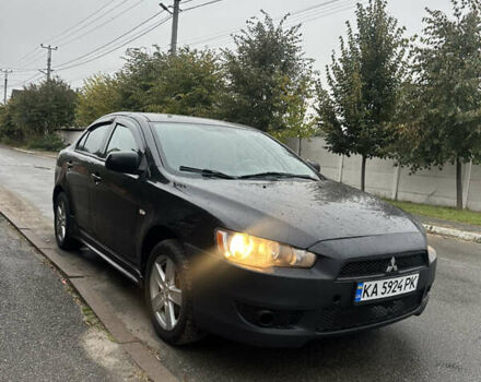 Чорний Міцубісі Lancer, об'ємом двигуна 2 л та пробігом 292 тис. км за 4400 $, фото 1 на Automoto.ua