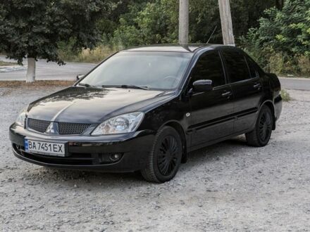 Черный Мицубиси Лансер, объемом двигателя 1.6 л и пробегом 226 тыс. км за 4800 $, фото 1 на Automoto.ua