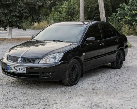 Черный Мицубиси Лансер, объемом двигателя 1.6 л и пробегом 226 тыс. км за 4800 $, фото 1 на Automoto.ua