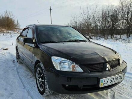 Міцубісі Lancer 2007 у Харкові на Automoto.ua Чорний Міцубісі Lancer, об'ємом двигуна 1.6 л та пробігом 240 тис. км за 3500 $, фото 1 на Automoto.ua