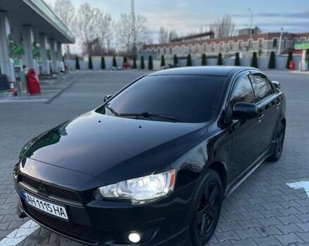 Черный Мицубиси Лансер, объемом двигателя 2 л и пробегом 245 тыс. км за 6950 $, фото 1 на Automoto.ua