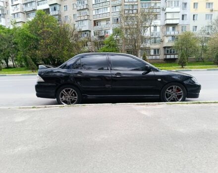 Чорний Міцубісі Lancer, об'ємом двигуна 2 л та пробігом 270 тис. км за 5000 $, фото 1 на Automoto.ua