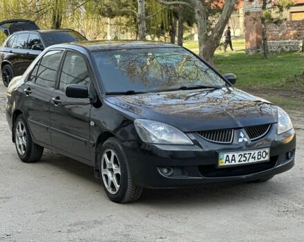 Черный Мицубиси Лансер, объемом двигателя 1.6 л и пробегом 230 тыс. км за 4300 $, фото 1 на Automoto.ua