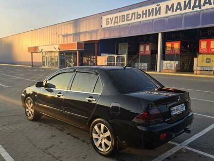 Черный Мицубиси Лансер, объемом двигателя 1.6 л и пробегом 210 тыс. км за 5100 $, фото 1 на Automoto.ua